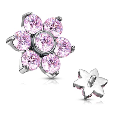 Dermal ankare med stenar och blomma.