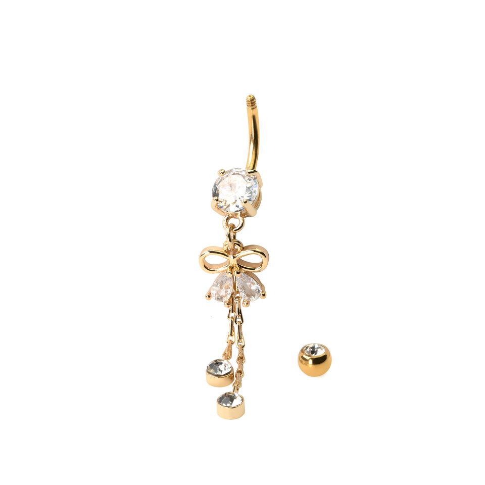 Navelpiercing med rosett och hänge