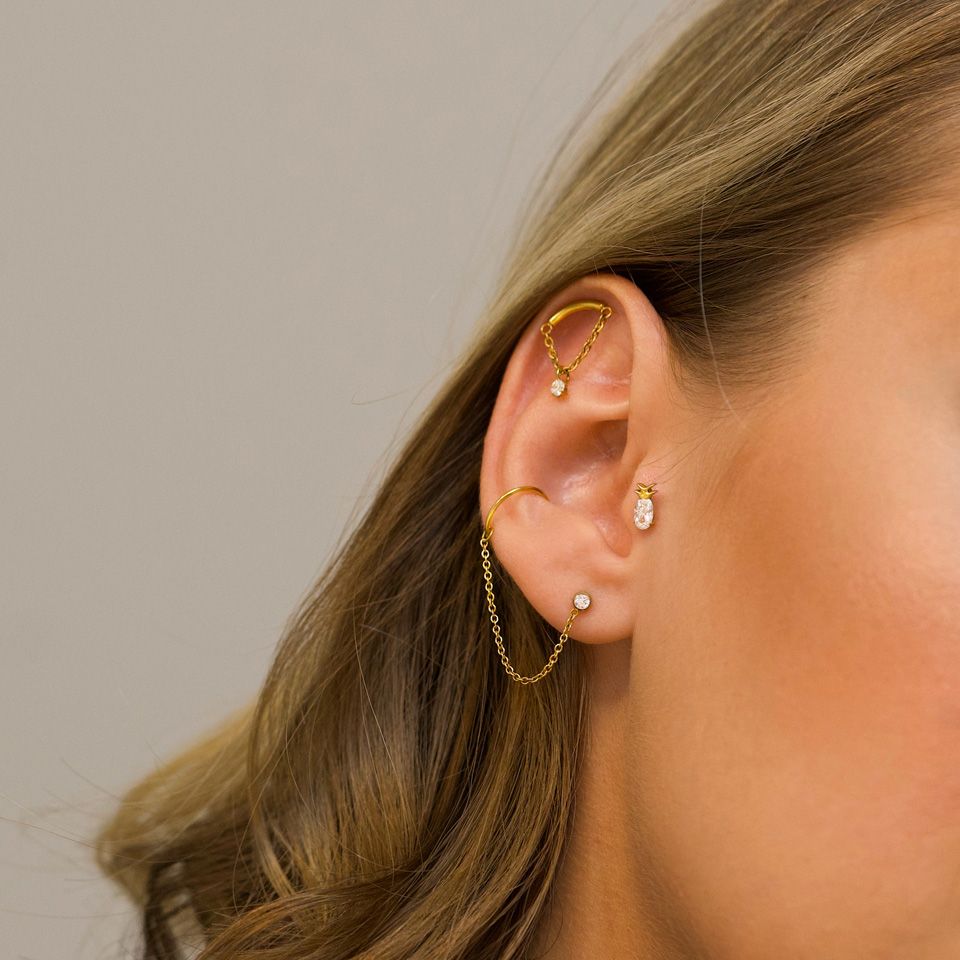 Böjd labret med kedja och stenberlock