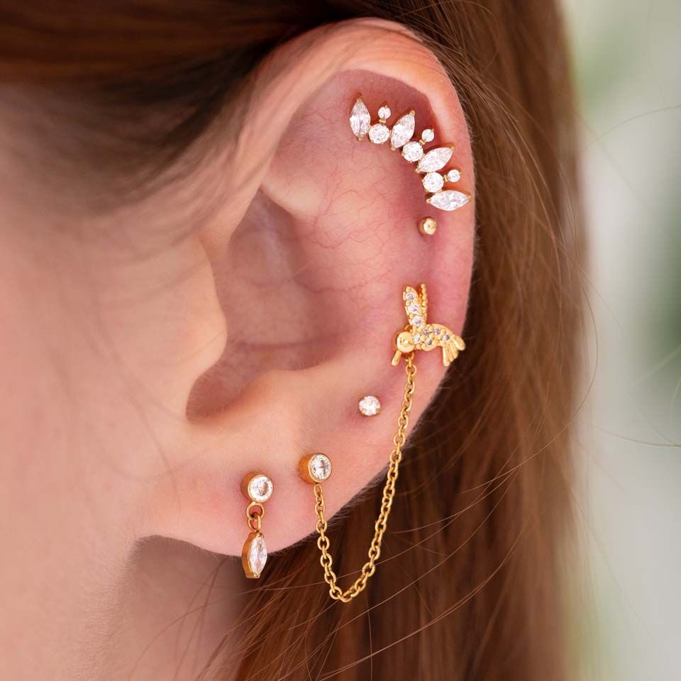 Labret med stensmyckad kolibri
