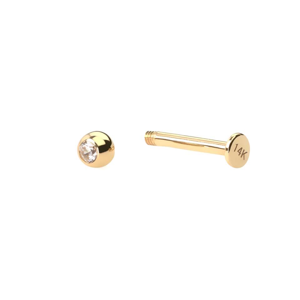 Labret av 14 kt guld med sten