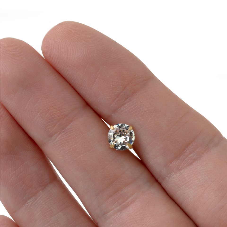 Tungpiercing med klor runt sten