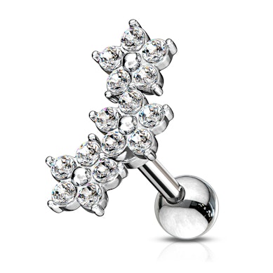 Öronpiercing med blommor och stenar