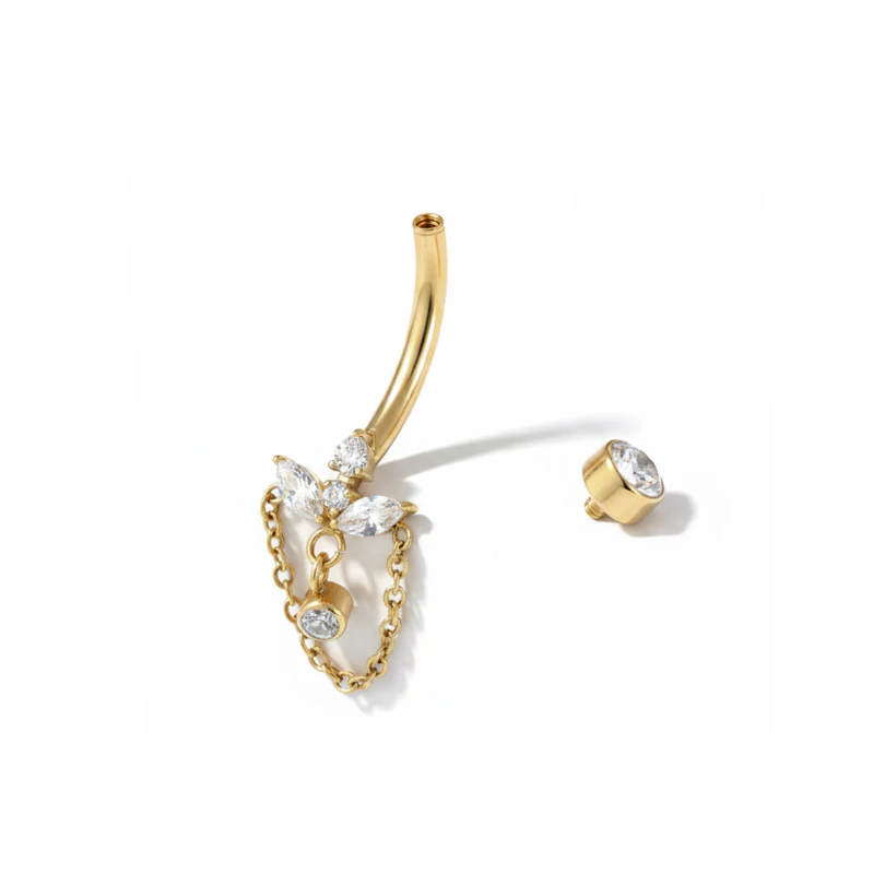 Navelpiercing med lotusblomma och kedja
