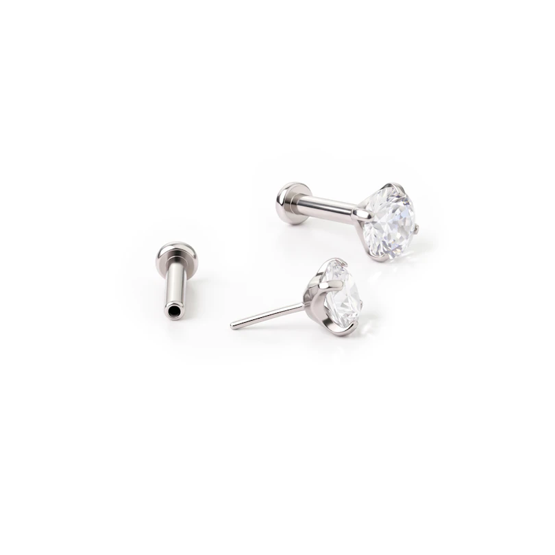 Push-in labret av titan med sten