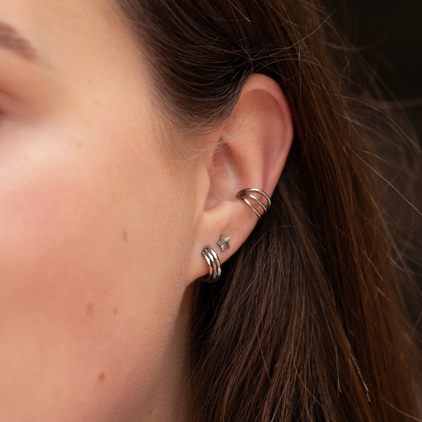 Stjärnformad labret i titan med strukturmönster