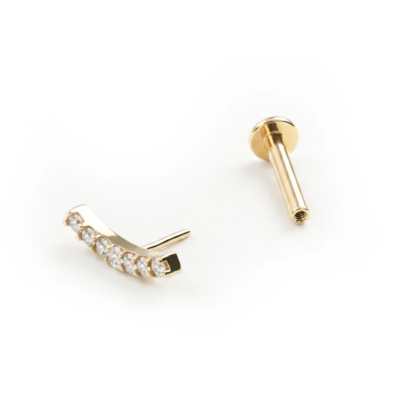 Push-in labret gjord av 14k guld med CZ stenlagd böjd topp