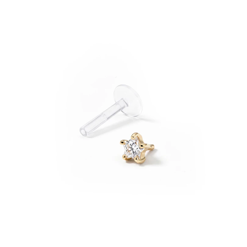 Labret av 14 karats guld med stjärnformad sten och ptfe stav