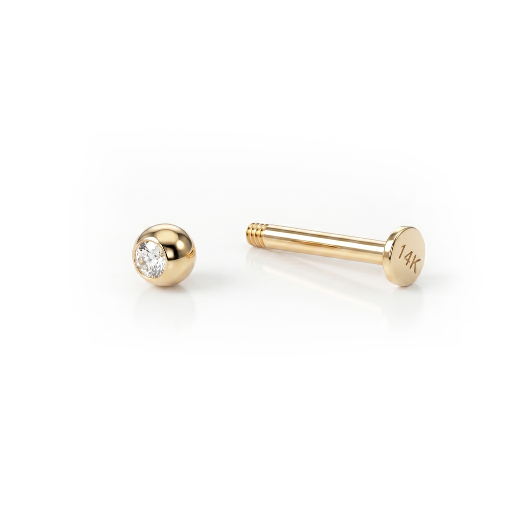 Labret av 14 kt guld med sten