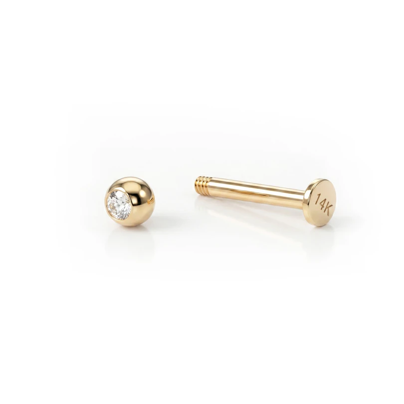 Labret av 14 kt guld med sten