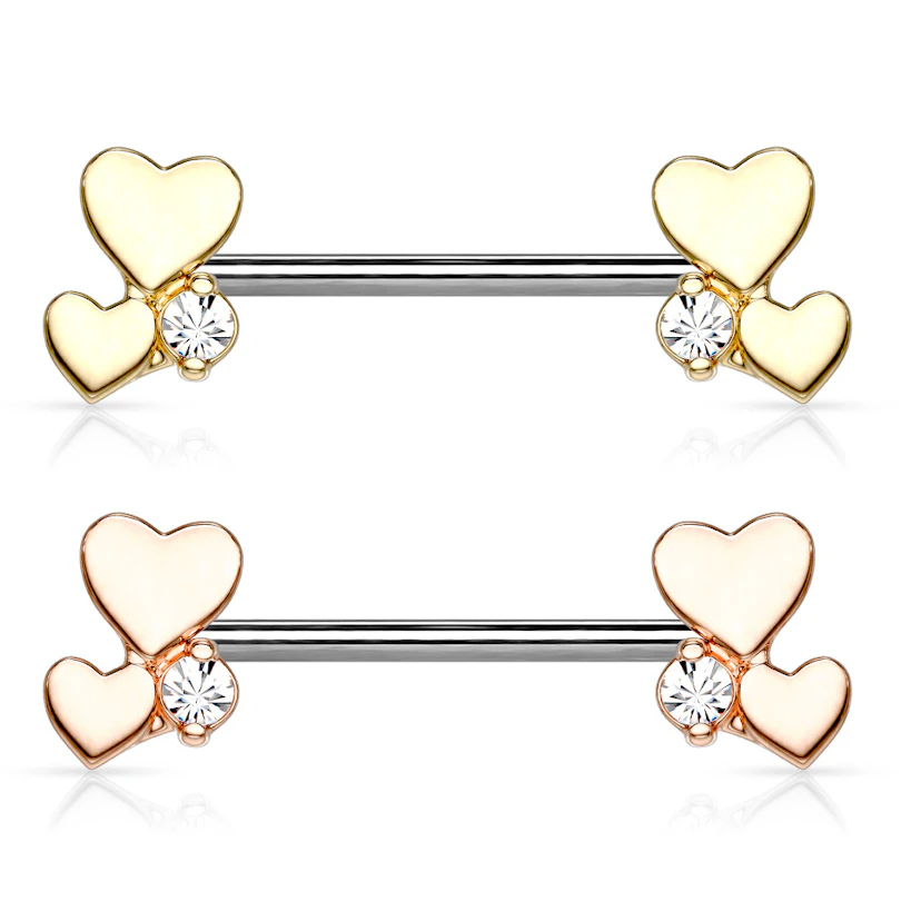 Bröstpiercing med två hjärtan