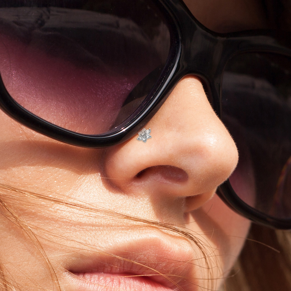 Nässkruv av 14 karat guld med blomma