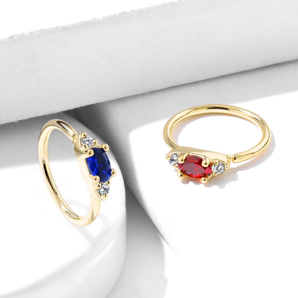 Ring med oval sten i flera färger